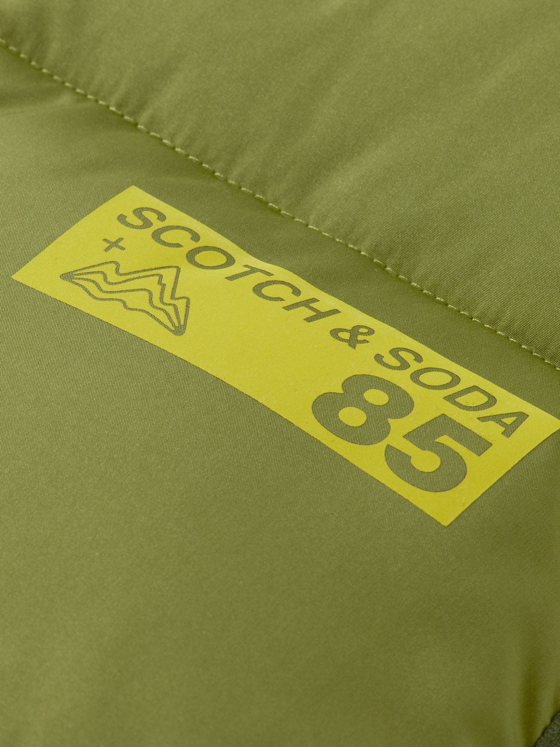 Kids padded bodywarmer by Scotch & Soda, showing a colorful sleeveless insulated vest suitable for children.