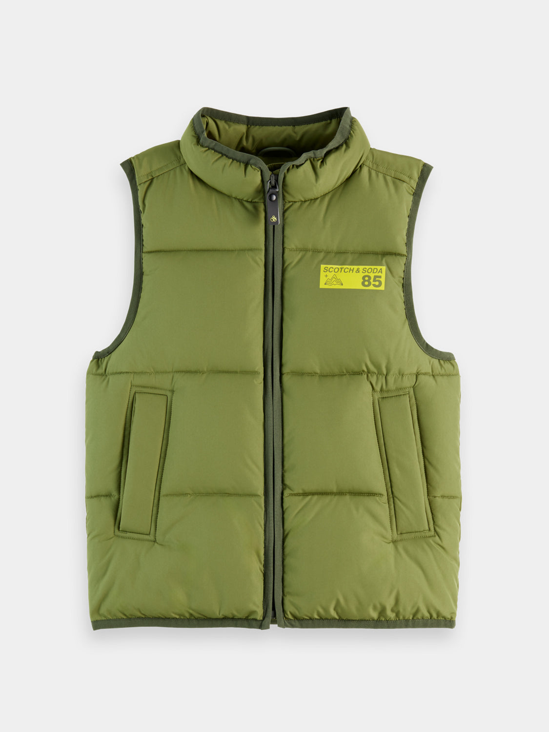 Kids padded bodywarmer by Scotch & Soda, showing a colorful insulated sleeveless jacket with zipper front and quilted design.