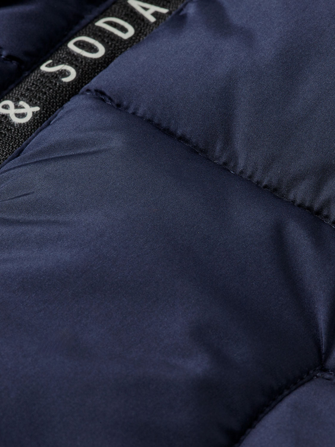 Kids' hooded puffer jacket by Scotch & Soda, featuring a cozy insulated design and a stylish hood for cold weather.