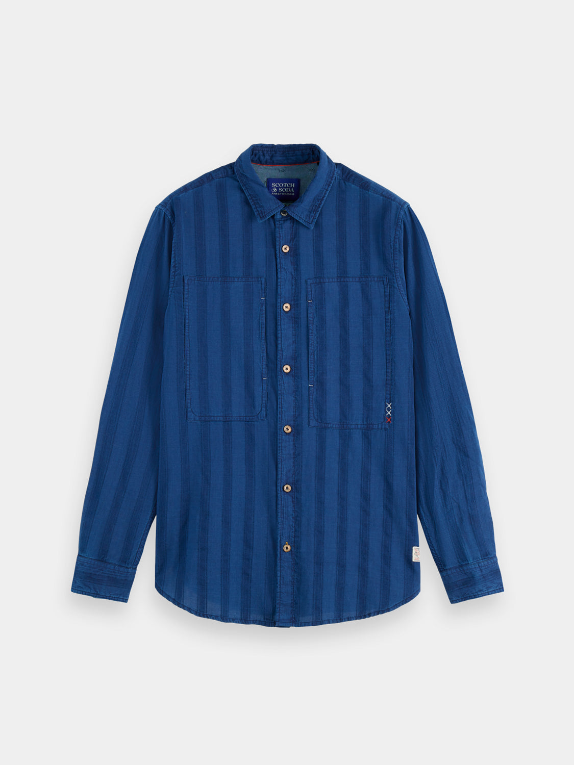 Textured indigo Scotch & SODA long-sleeve shirt with a casual fit, showcasing detailed fabric and button-down design.
