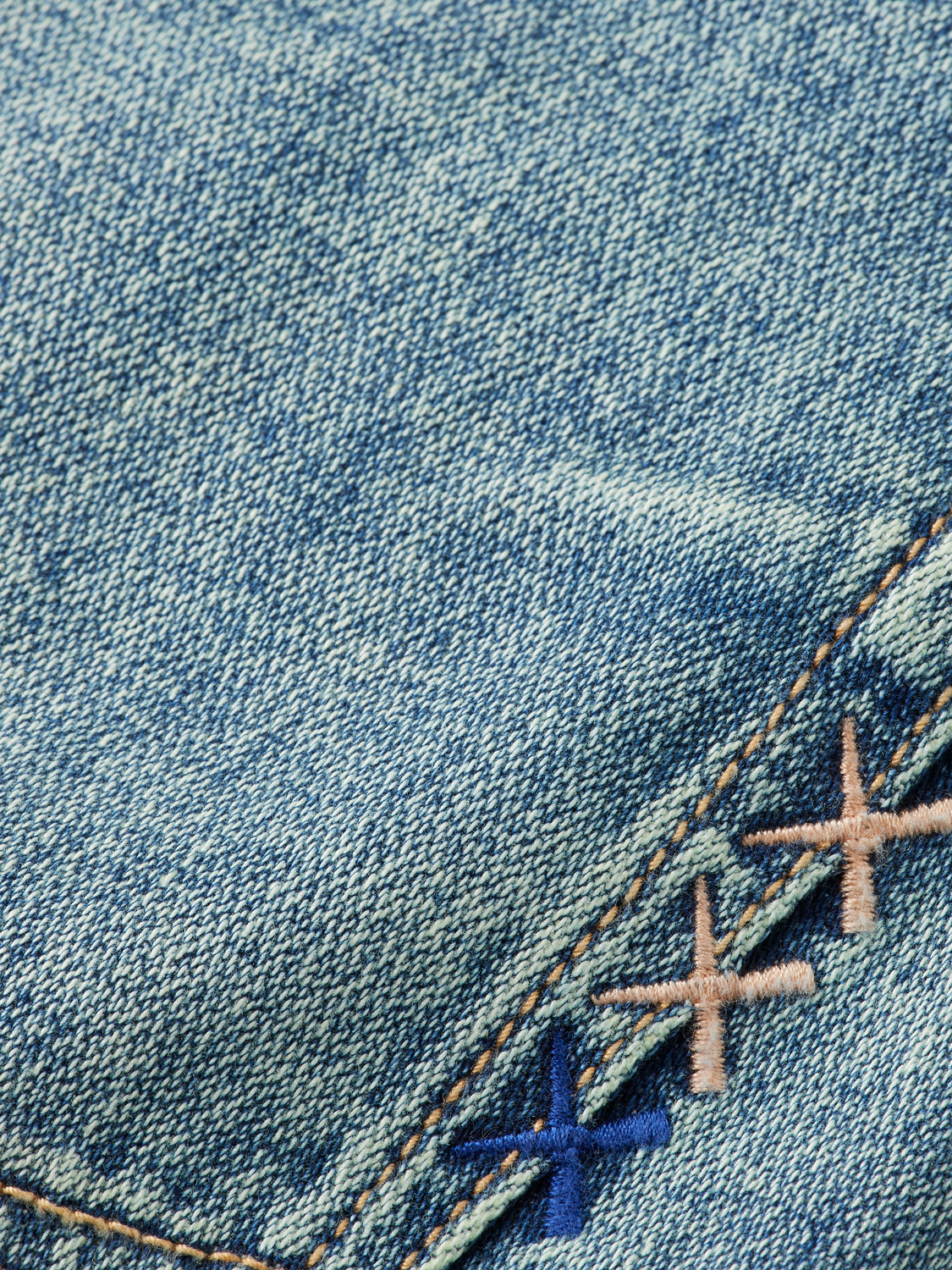 SCOTCH & SODA Zee straight-fit denim jeans displayed on a hanger, showcasing classic blue denim with subtle stitching details.