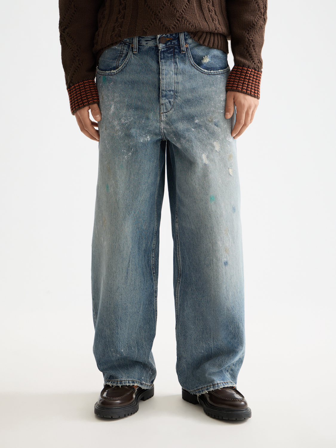 Scotch & Soda Daze loose fit denim jeans with front pockets and faded wash, styled on a model.