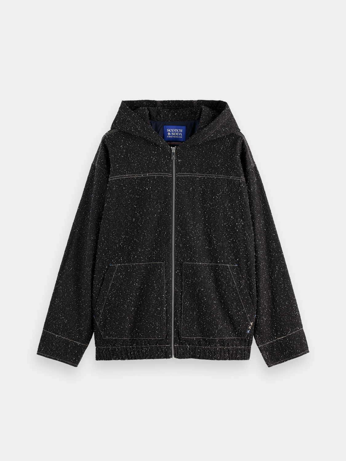 Dark blue Scotch & Soda denim jacket with classic collar and button closure, displayed on a hanger.