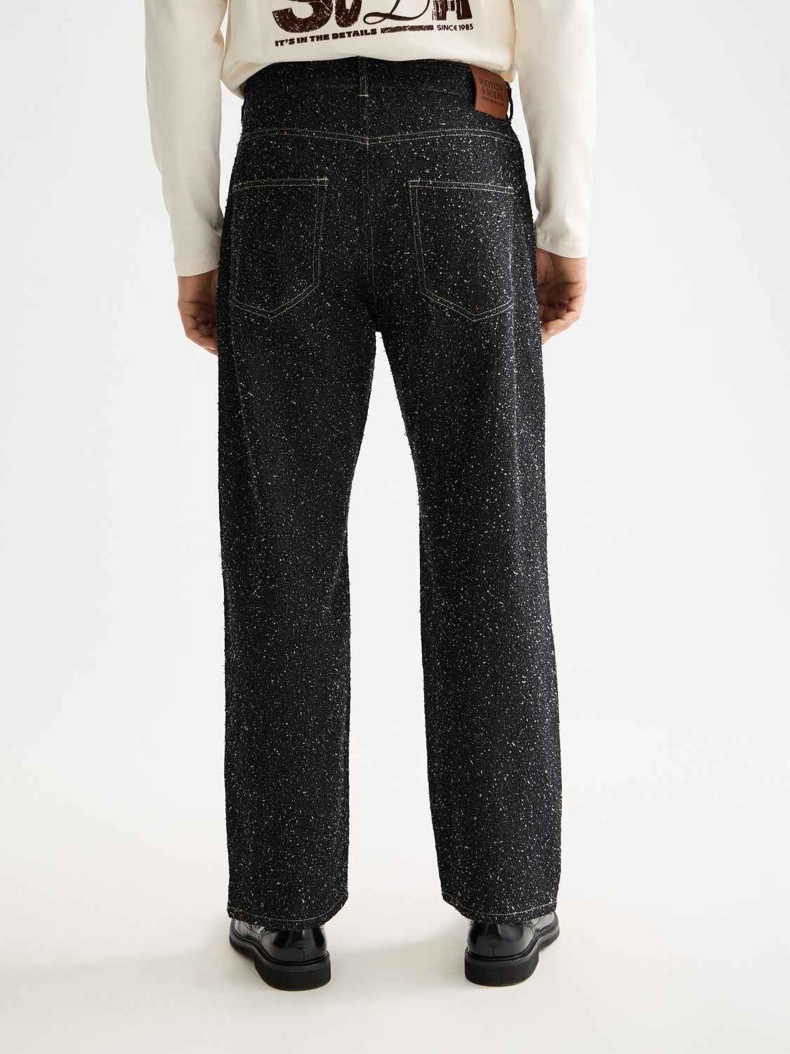 Scotch & Soda pitch loose-fit denim jeans with classic five-pocket design and light blue wash, front view.