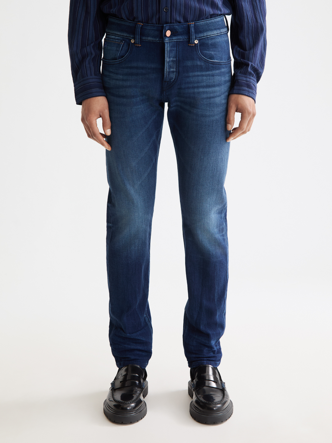 Scarlet slim-fit Scotch & Soda denim jeans with classic five-pocket design and subtle fading, front view.