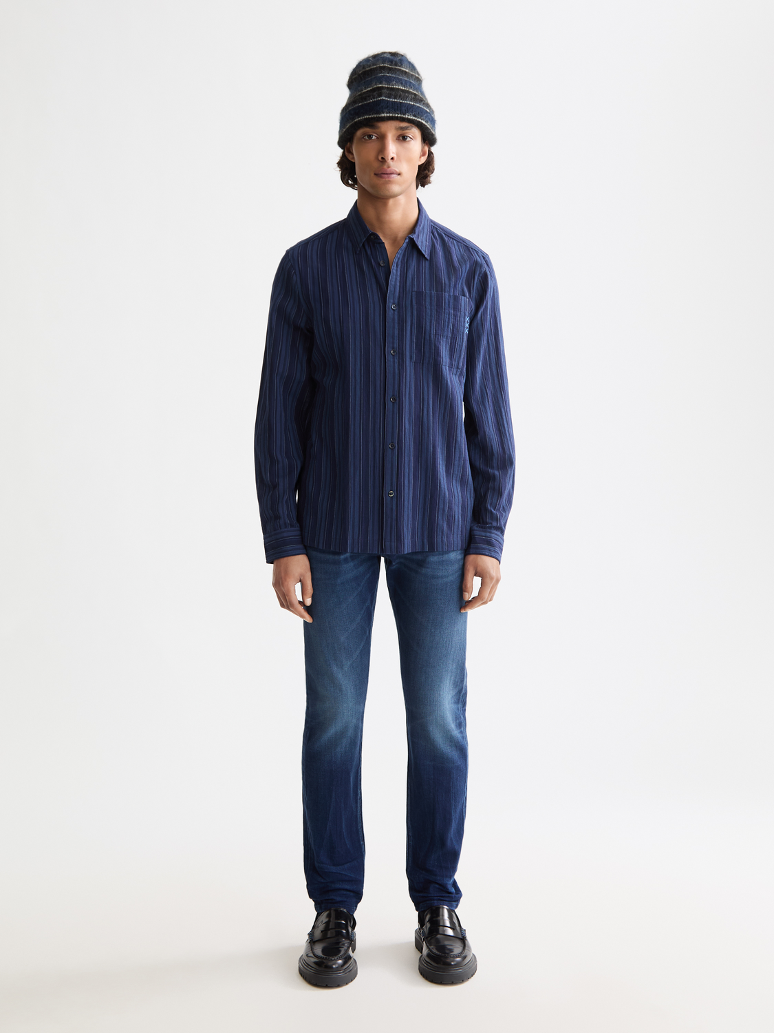 Slim-fit denim jeans from Scotch & Soda with classic five-pocket design and dark wash, shown in front view.