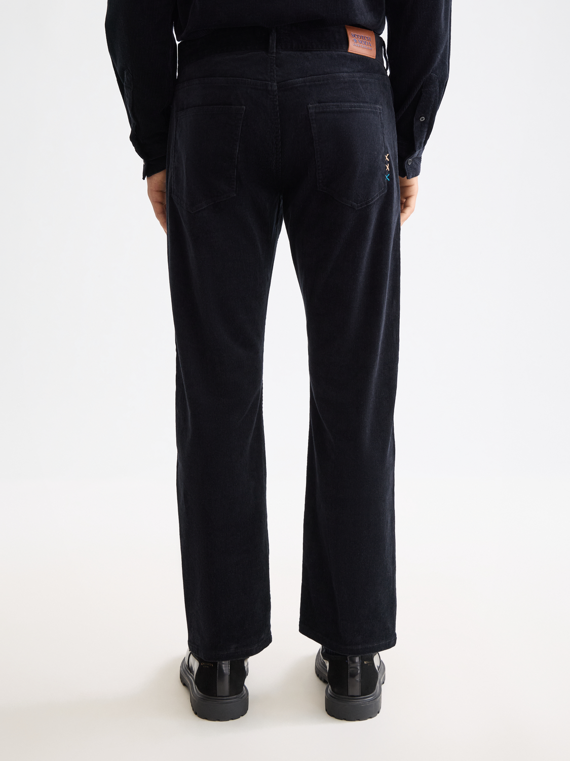 Scotch & Soda Zee straight-fit pants in dark denim, back view showing classic five-pocket design and stitched detailing.