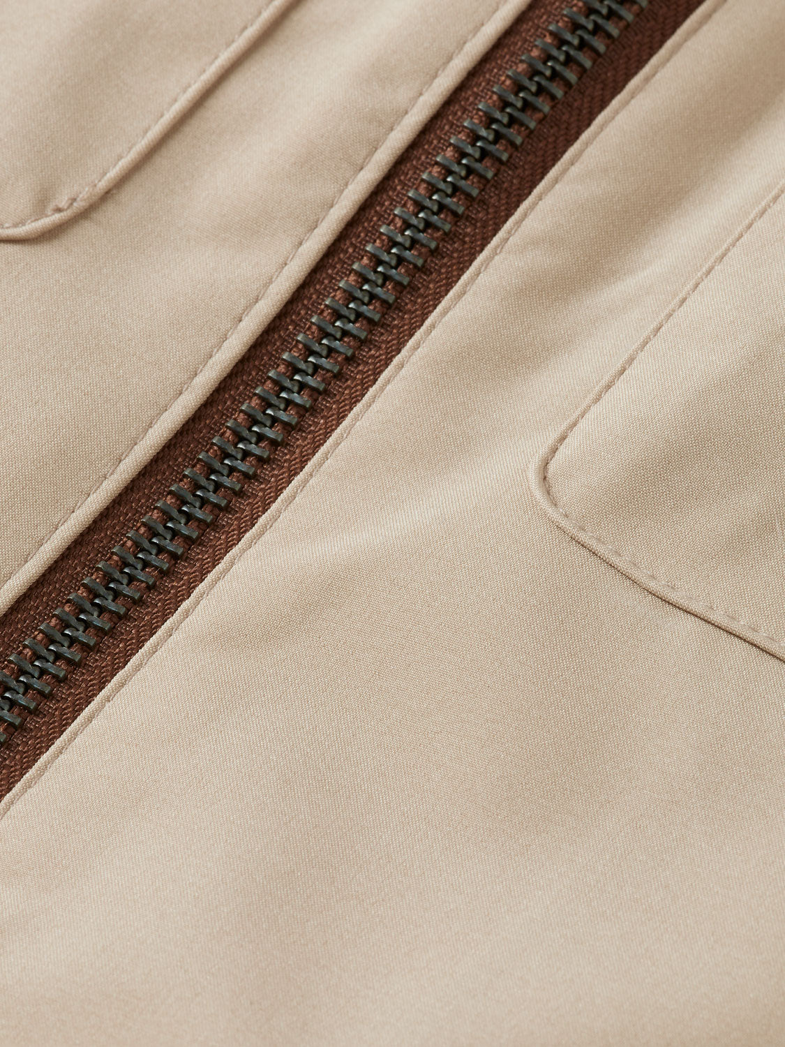 SCOTCH & SODA hooded softshell jacket displaying a sleek, dark-colored design with a front zipper and adjustable hood.