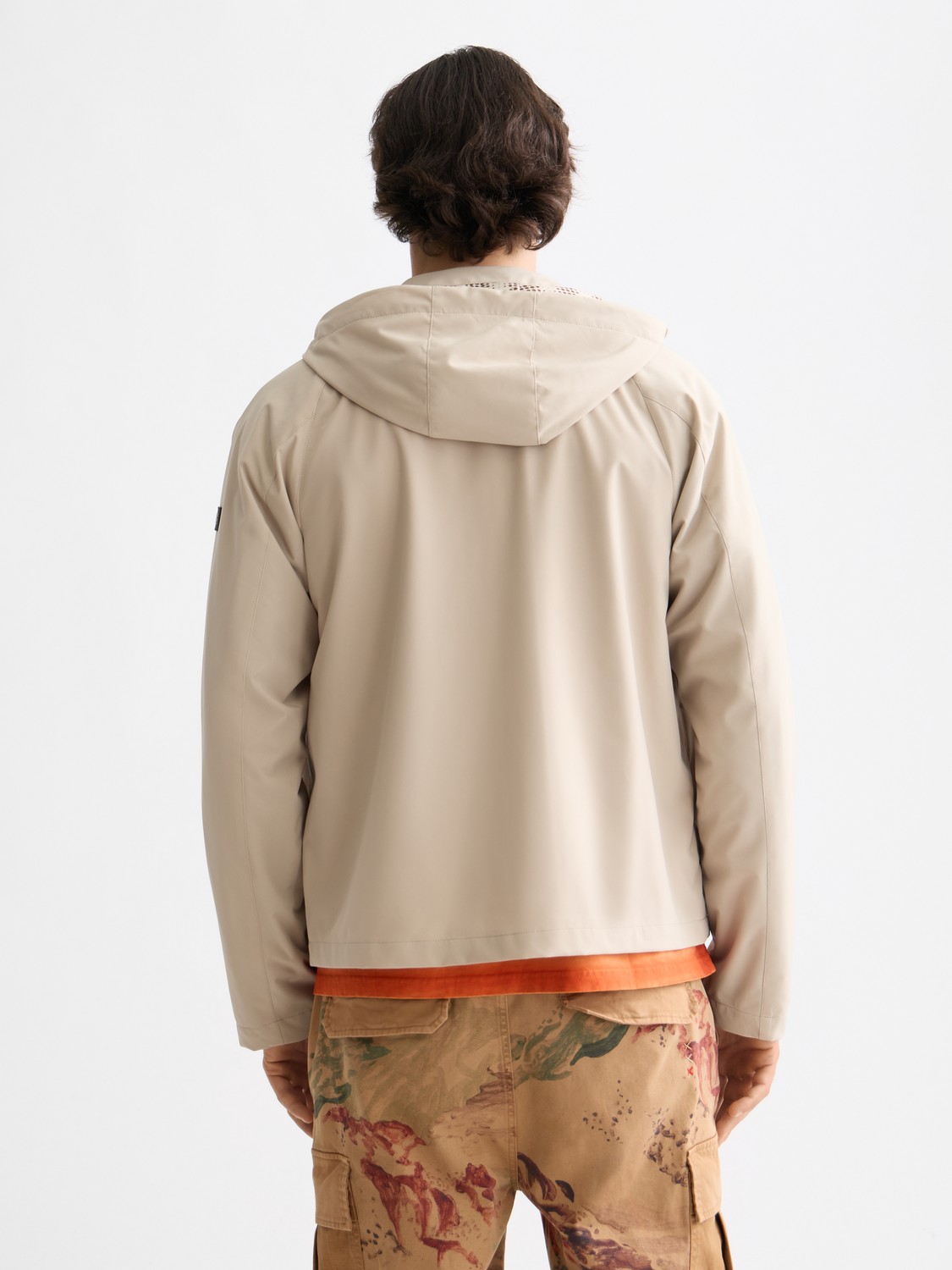 SCOTCH & SODA hooded softshell jacket in black, shown from the back with a sleek, fitted design and front zipper closure.