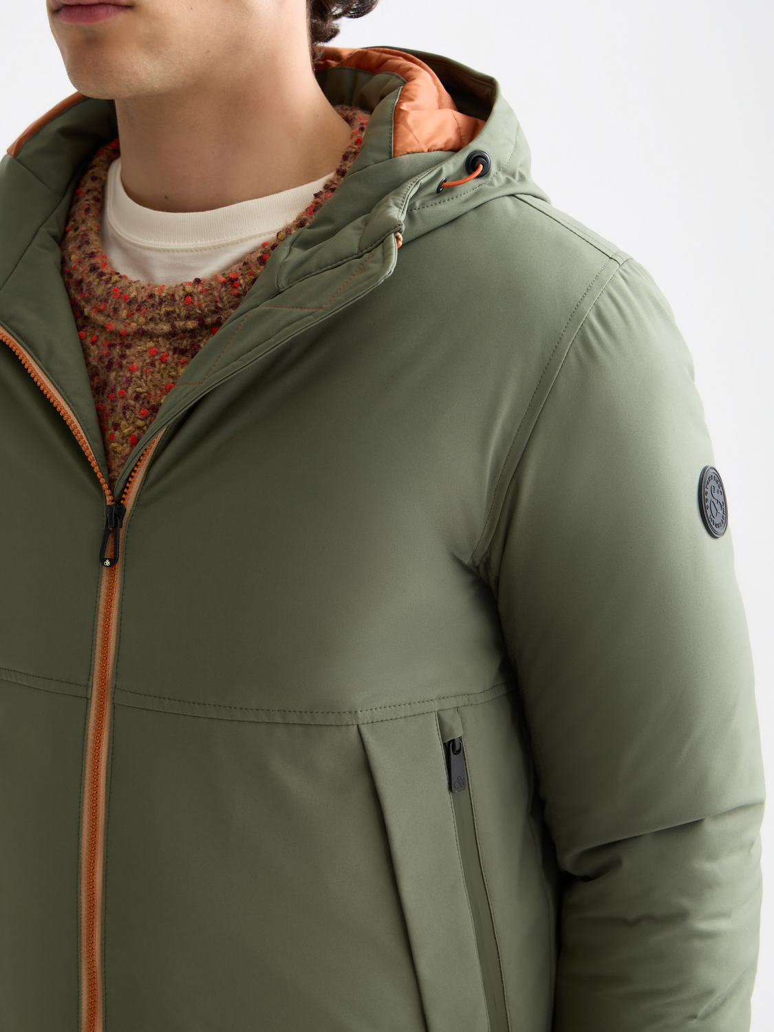 SCOTCH & SODA hooded softshell jacket, close-up view showing lightweight fabric, hood, and front zipper detailing.