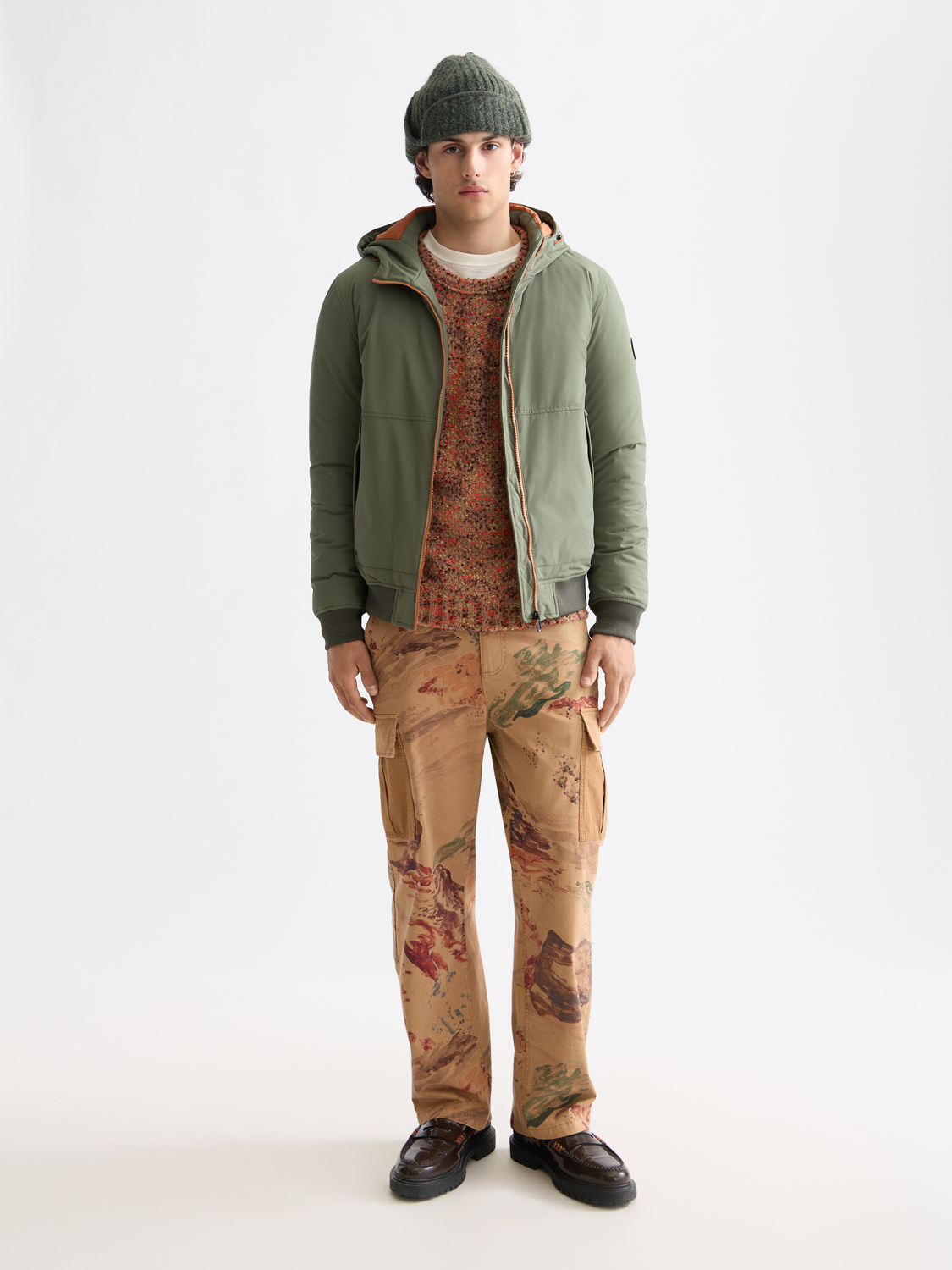 SCOTCH & SODA hooded softshell jacket with front zipper and adjustable hood, lightweight and breathable outdoor outerwear.