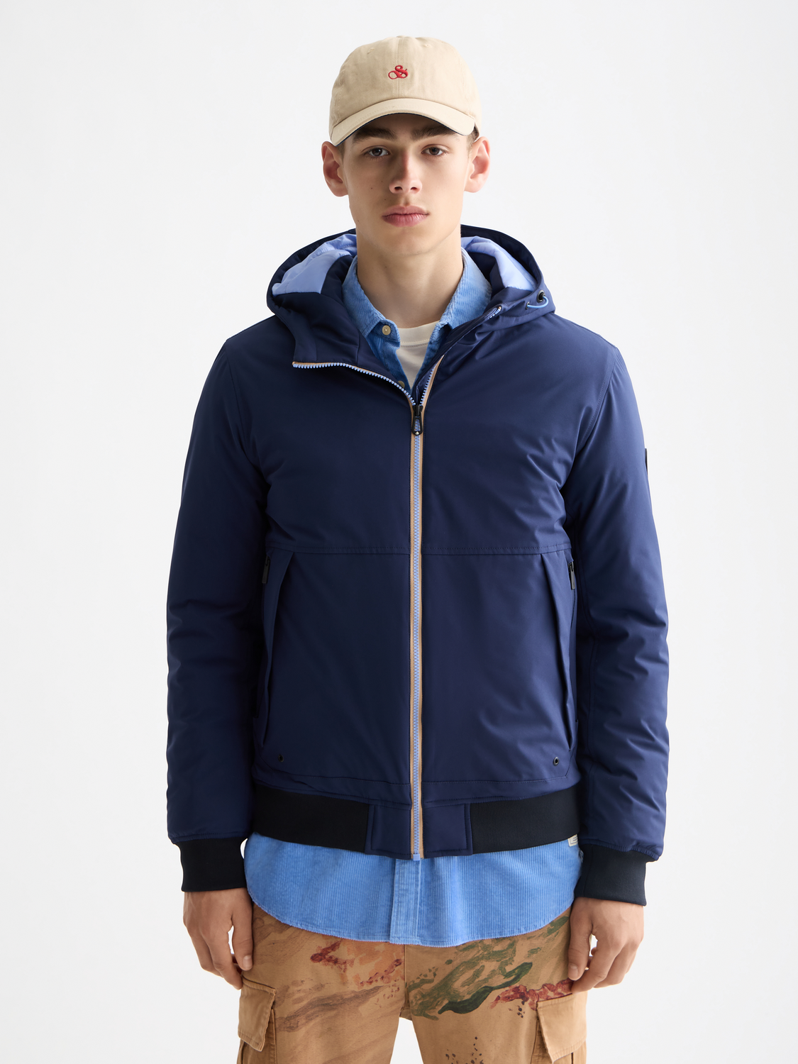 SCOTCH & SODA hooded softshell jacket with front zipper, shown in a close-up view highlighting the fabric and hood details.