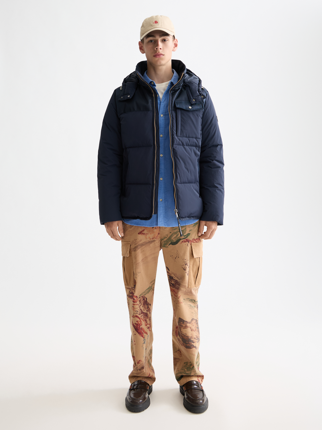 Scotch & Soda hooded puffer jacket in black with front zipper and quilted design, suitable for cold weather.