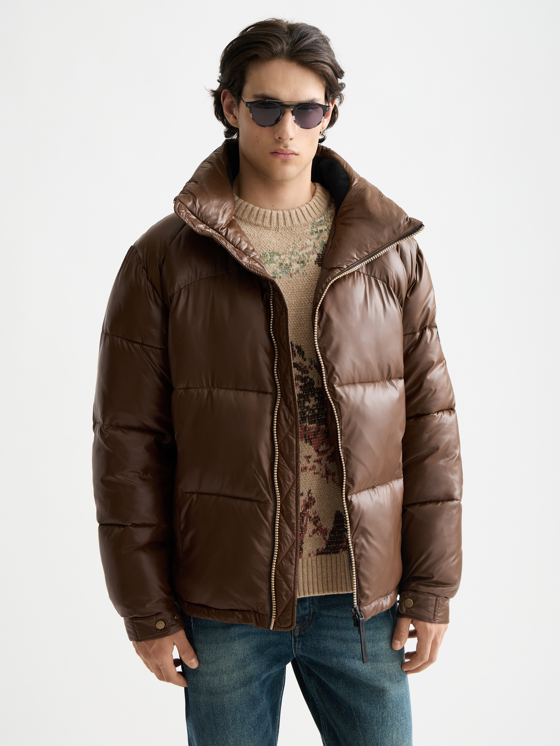 Lacquer puffer jacket by SCOTCH & SODA featuring shiny black material, front zipper, and quilted design for stylish warmth.