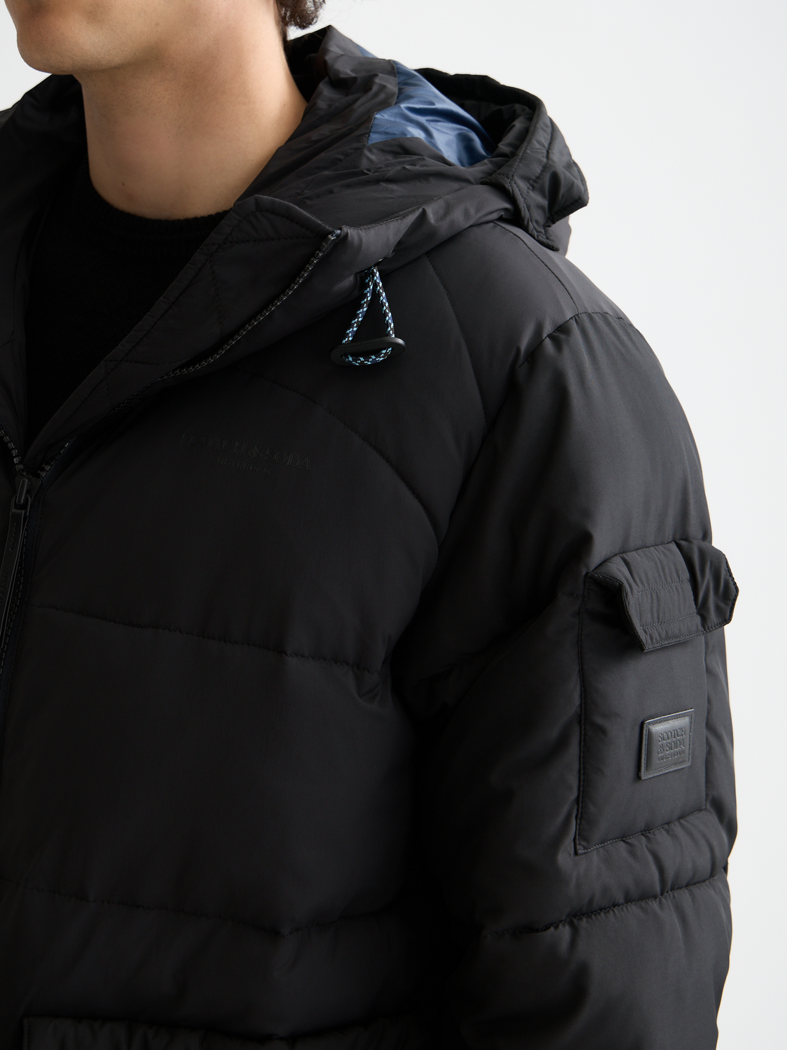 Long puffer jacket by Scotch & Soda, navy blue, insulated winter coat with a high collar and quilted design.