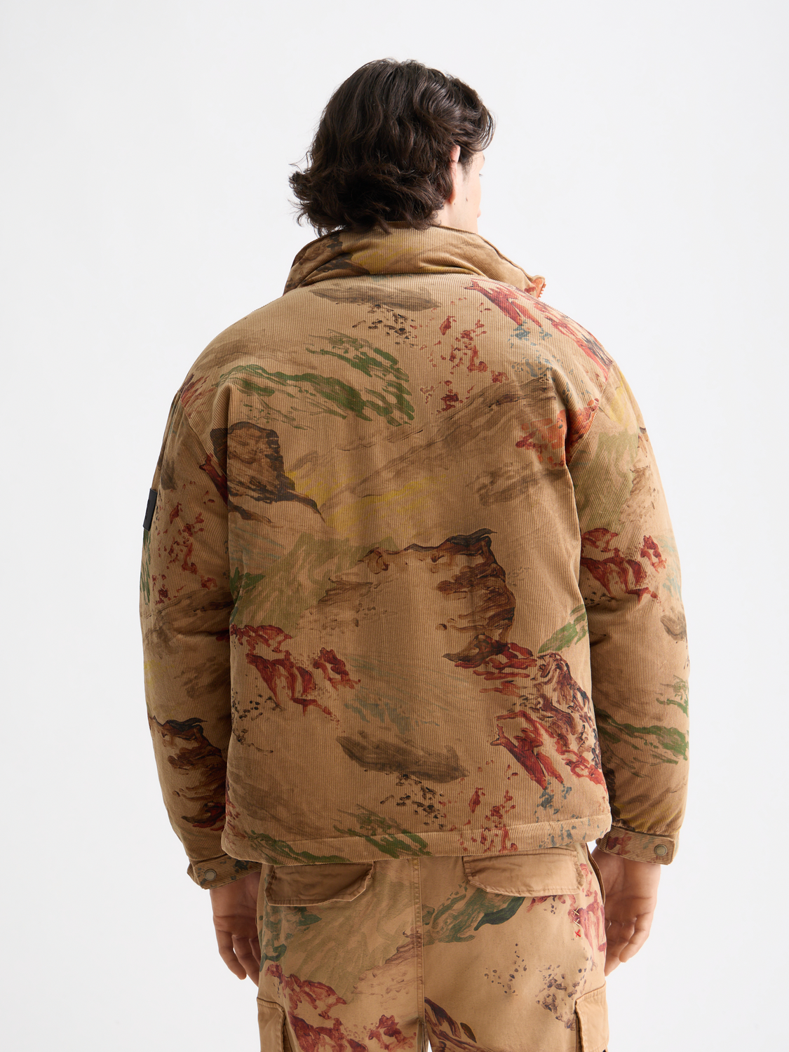 SCOTCH & SODA corduroy puffer jacket with quilted design and stand collar, shown in a front view.