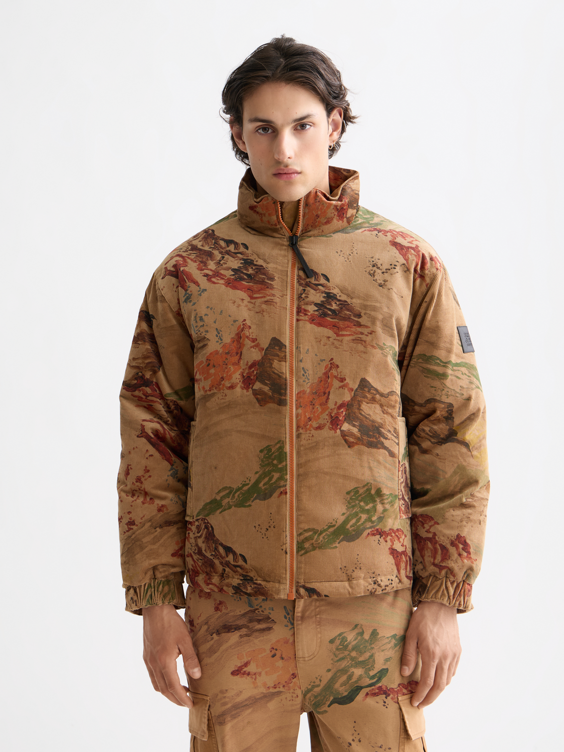 SCOTCH & SODA corduroy puffer jacket featuring a quilted design, stand-up collar, and front zipper for a stylish winter look.