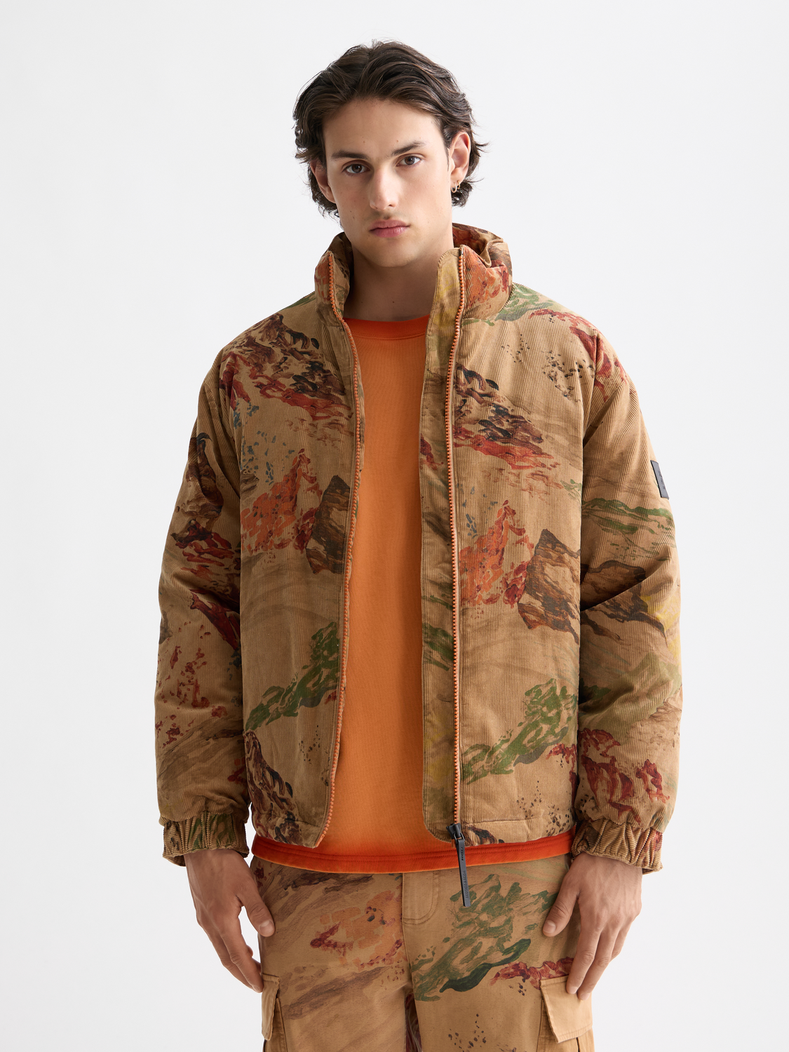 Scotch & Soda corduroy puffer jacket in navy with a high collar, front zipper, and quilted design, casual outerwear for cold weather.