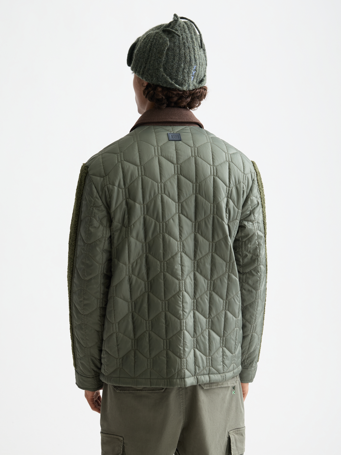 SCOTCH & SODA quilted military jacket with padded design, front zipper, and buttoned pockets, shown from the back view.