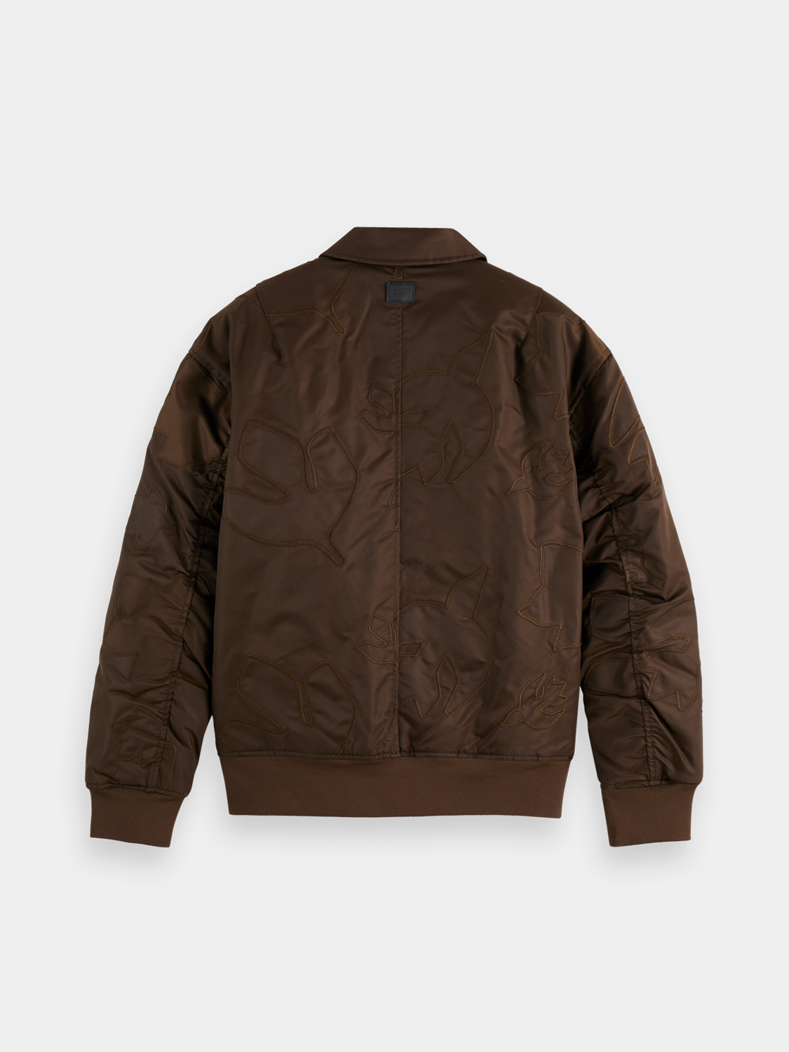 Scotch & Soda aviator bomber jacket with leather collar and zippered front, displayed on a hanger.