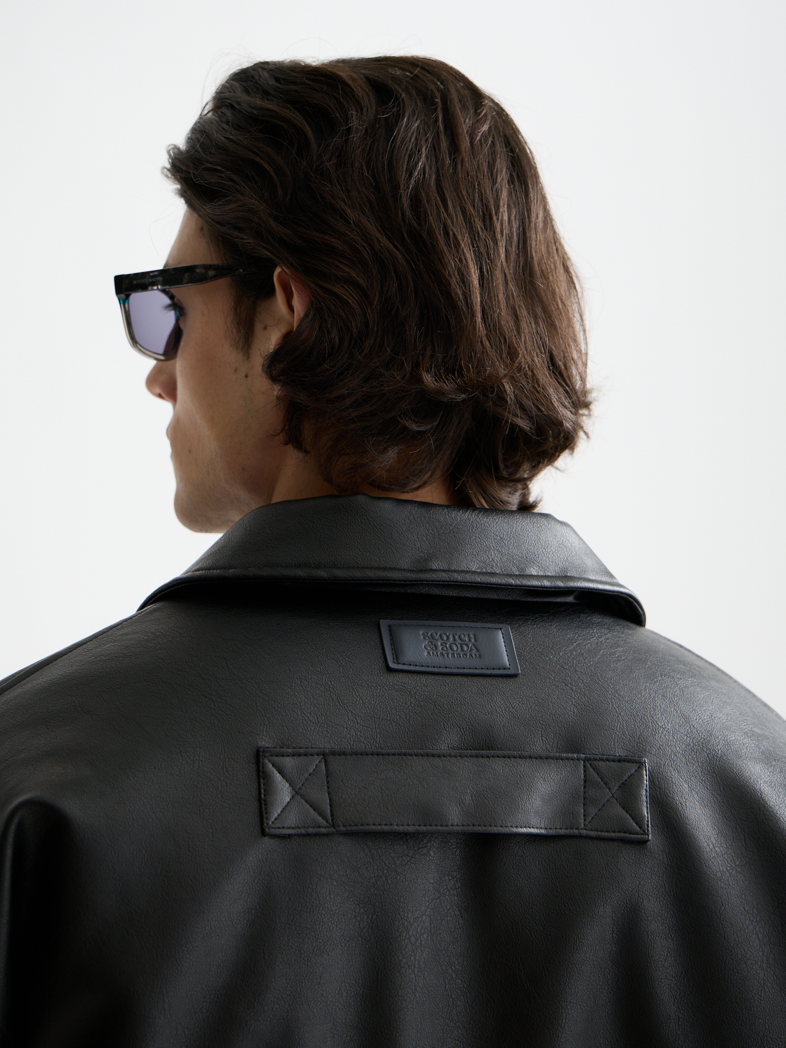 Scotch & Soda faux leather puffer jacket with quilted design and stand collar, stylish winter outerwear for cold weather.