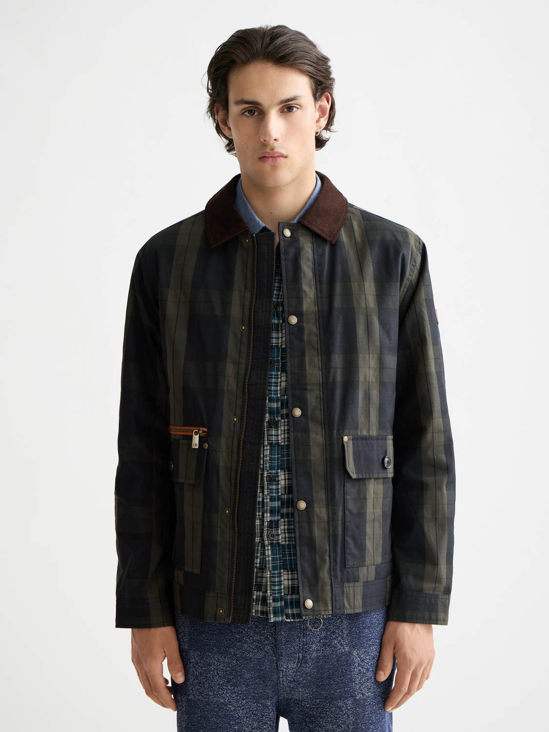 Wax cotton jacket from Scotch & Soda, featuring a classic fit with a collar, front pockets, and durable textured fabric.