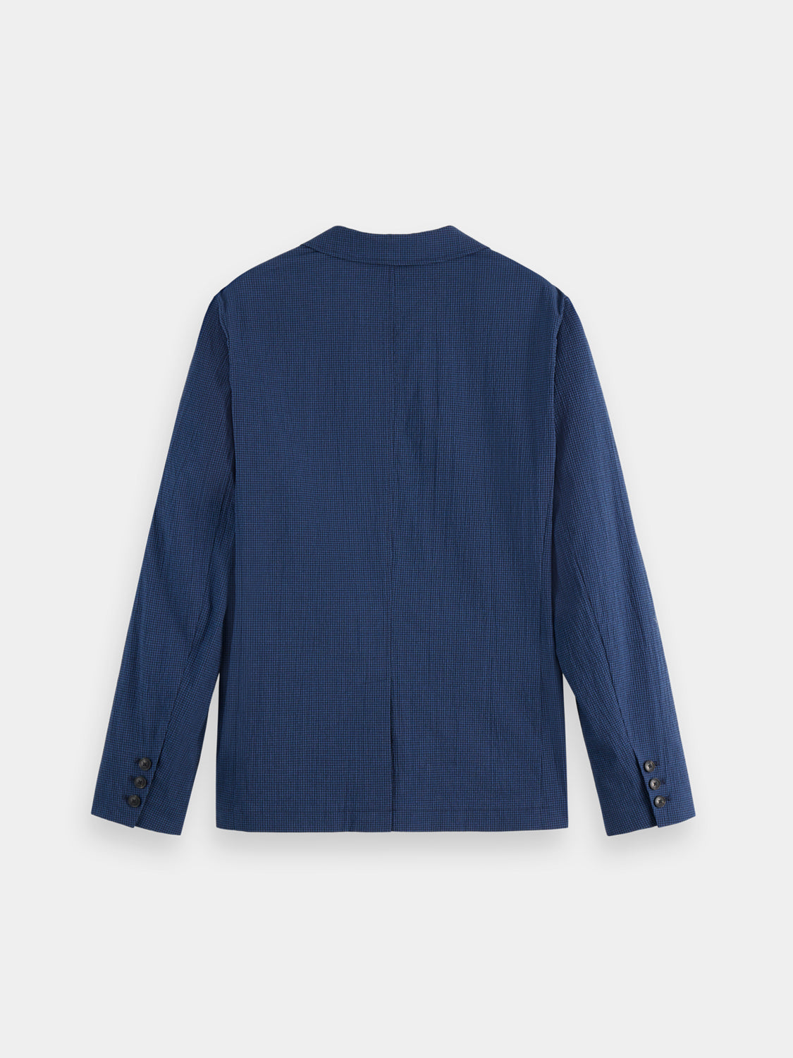 Dark blue Scotch & Soda seersucker blazer with notch lapels and tailored fit, displayed on a hanger.