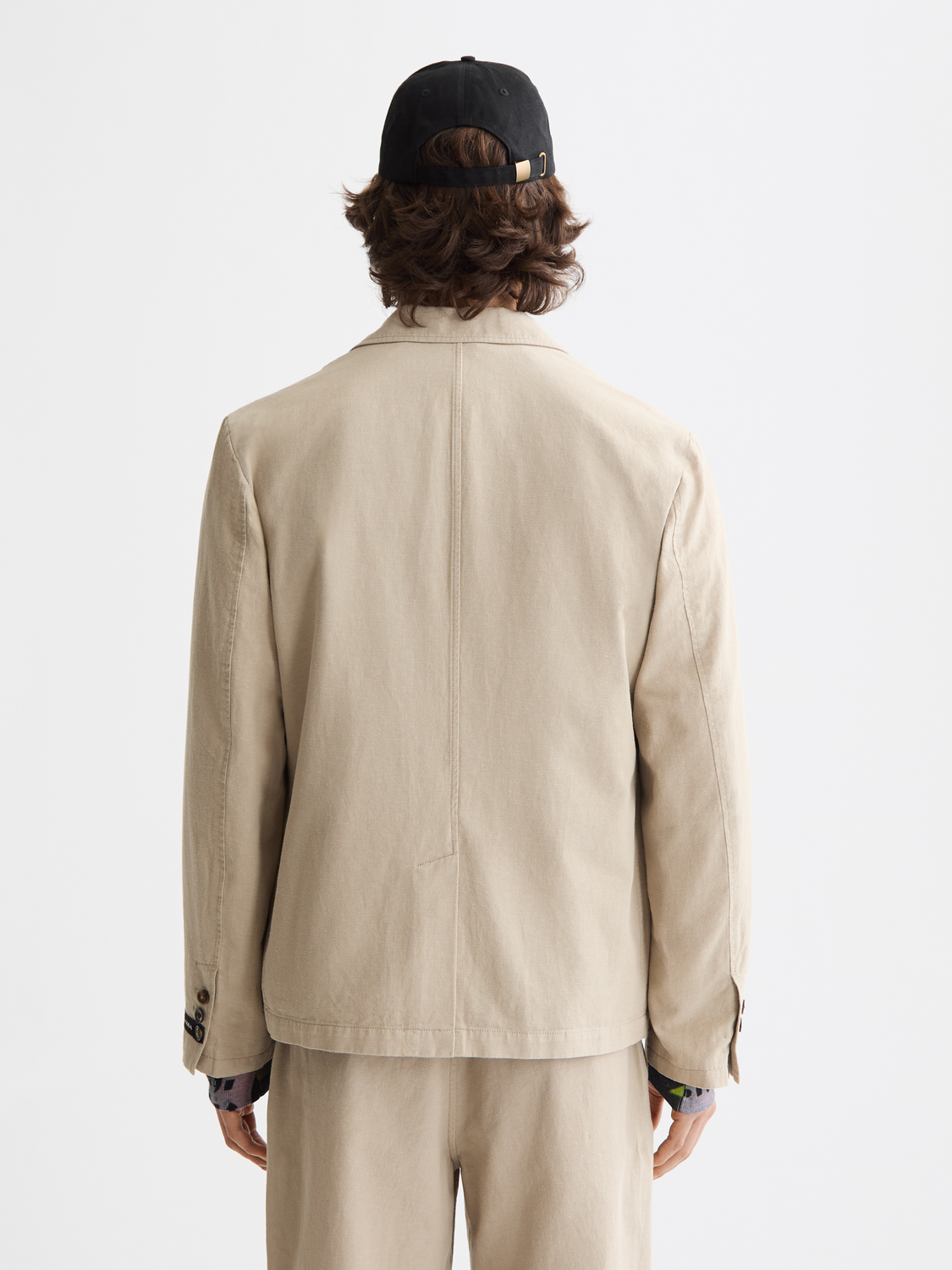 Relaxed-fit Scotch & Soda blazer in dark color, shown from the back with a tailored collar and sleek fabric.