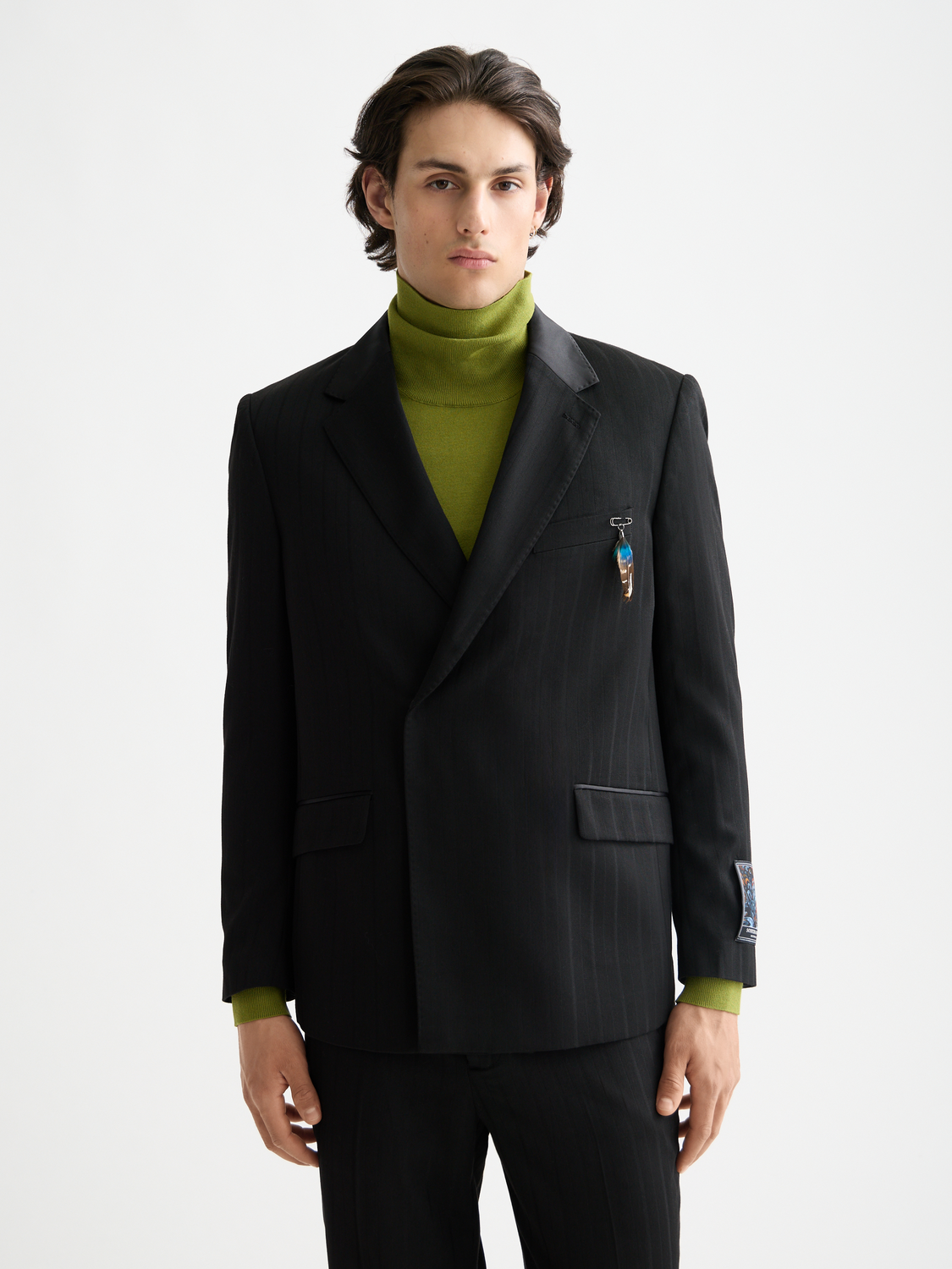 Scotch & Soda double-breasted blazer in dark fabric, featuring classic lapels and tailored fit, displayed on a hanger.