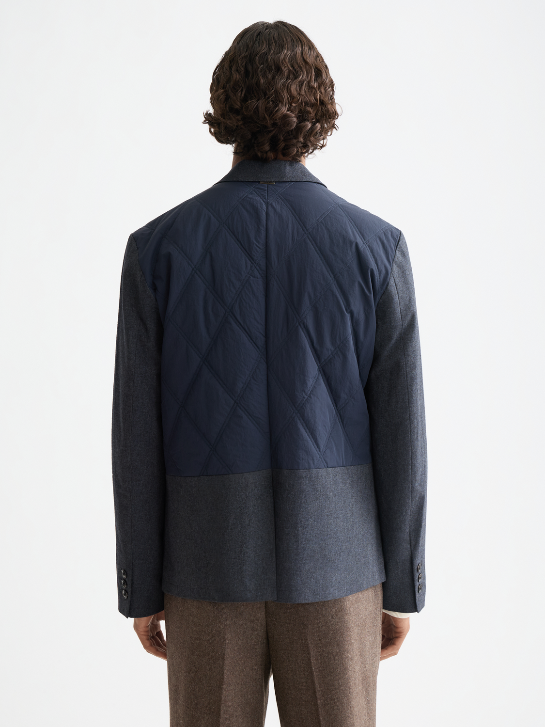 Colourblock padded blazer by Scotch & Soda, featuring bold color panels and a padded design, shown on a model.