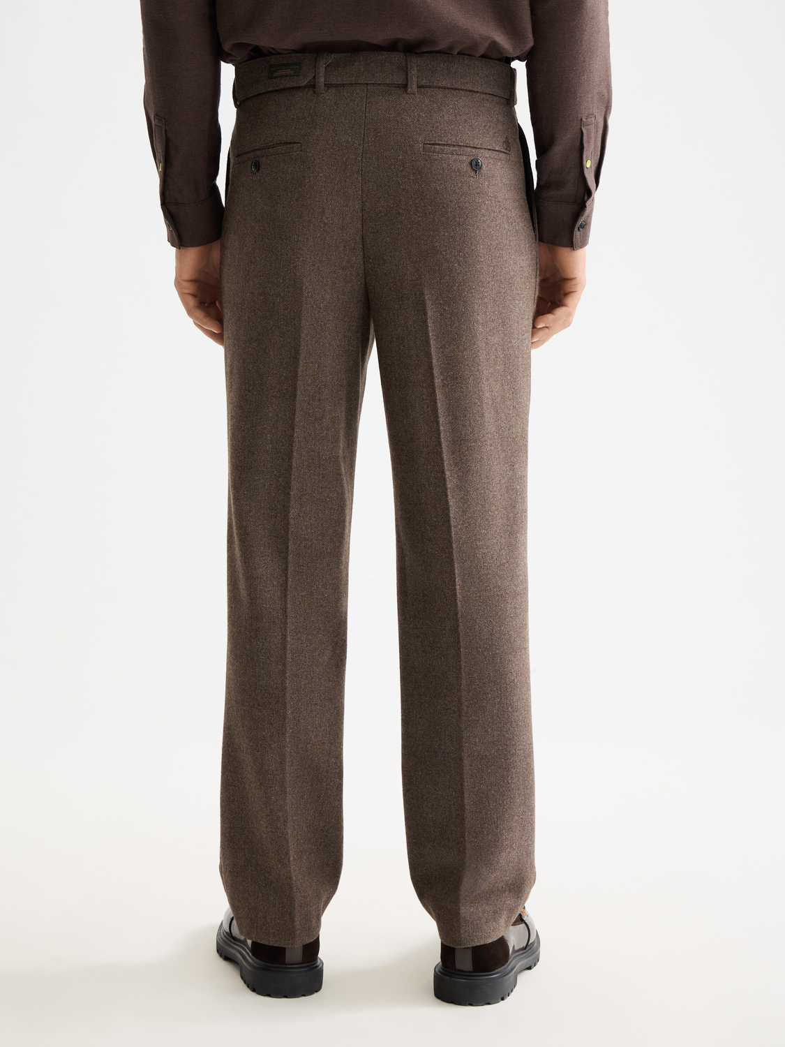 Yarn-dyed chinos pants in a dark color from Scotch & Soda, displayed with back and side views.