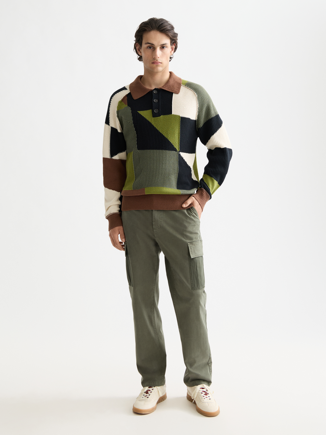 SCOTCH & SODA Harper cargo pants shown in beige with multiple pockets and relaxed fit, displayed on a hanger.