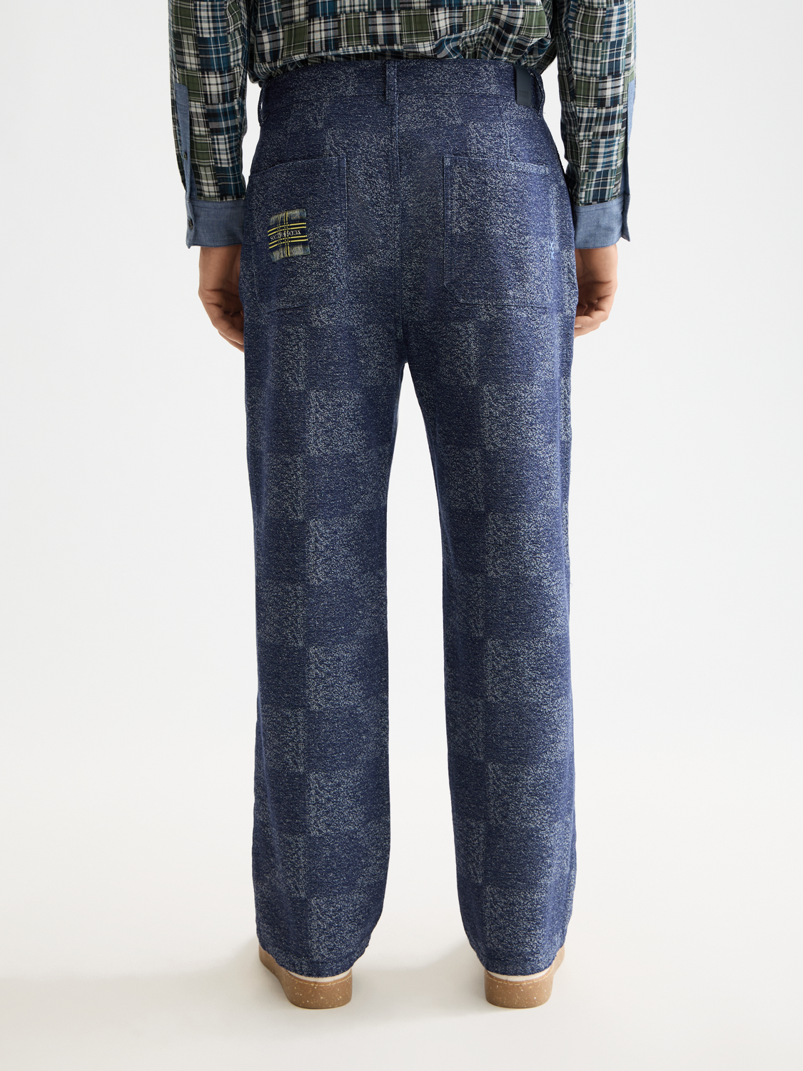 Loose-fit chinos pants by Scotch & Soda in a neutral color, shown from the back with a relaxed fit and classic design.