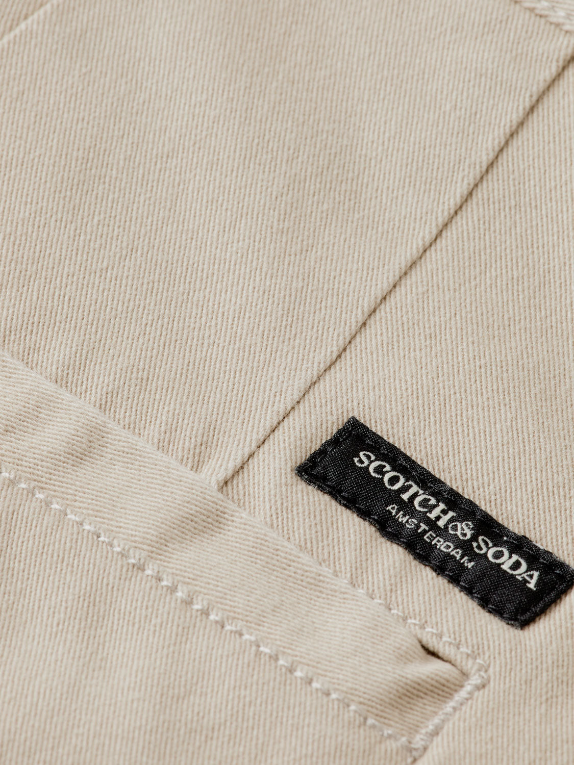 Scotch & Soda Stuart slim-fit chinos pants in a neutral color, showcasing the tailored fit and classic design.
