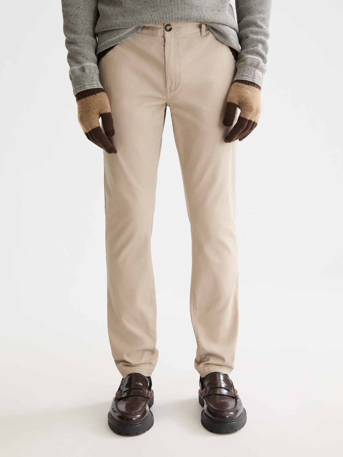 SCOTCH & SODA Mott slim-fit chinos pants in a neutral color, showing front view with waistband and pockets.
