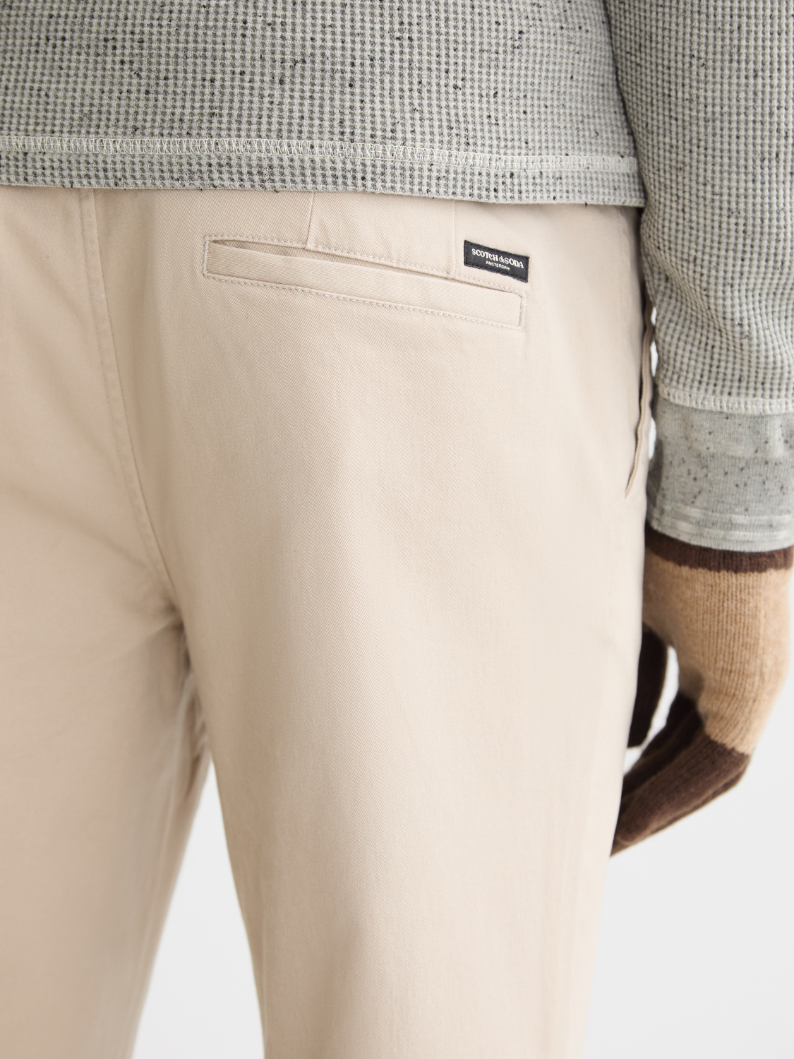 Slim-fit Mott chinos by Scotch & Soda, featuring classic design and tailored fit, shown in a neutral color.