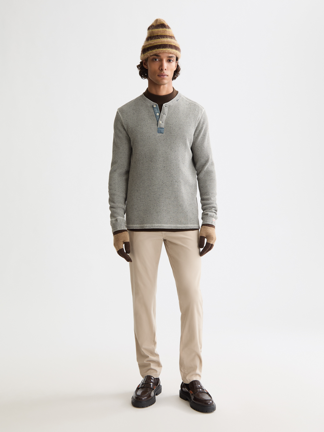 Slim-fit Mott chinos by Scotch & Soda, stylish men's pants in neutral color, shown on a model.
