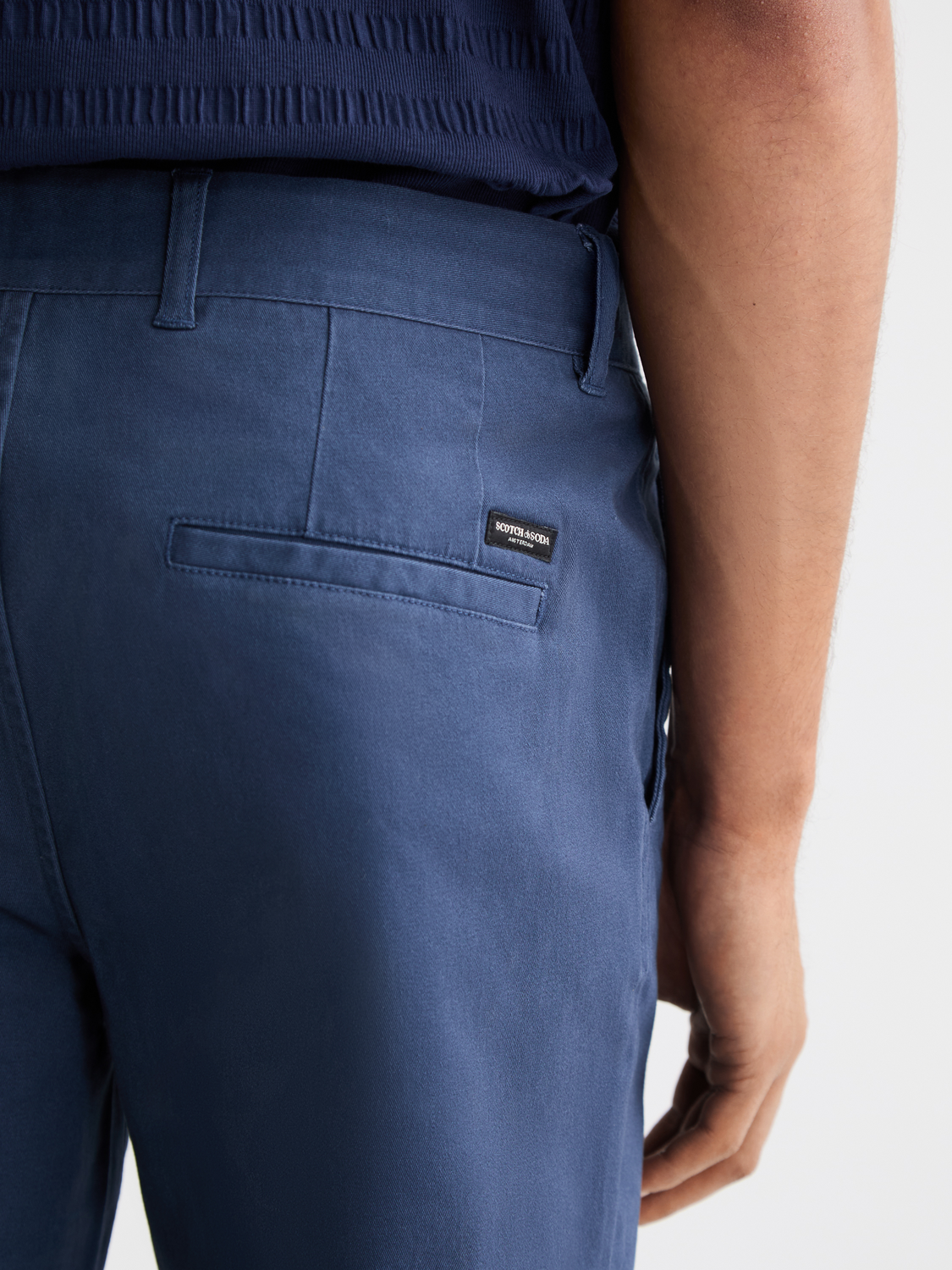 Slim-fit Mott chinos pants by Scotch & Soda, showing the tailored fit and classic design in a neutral color.