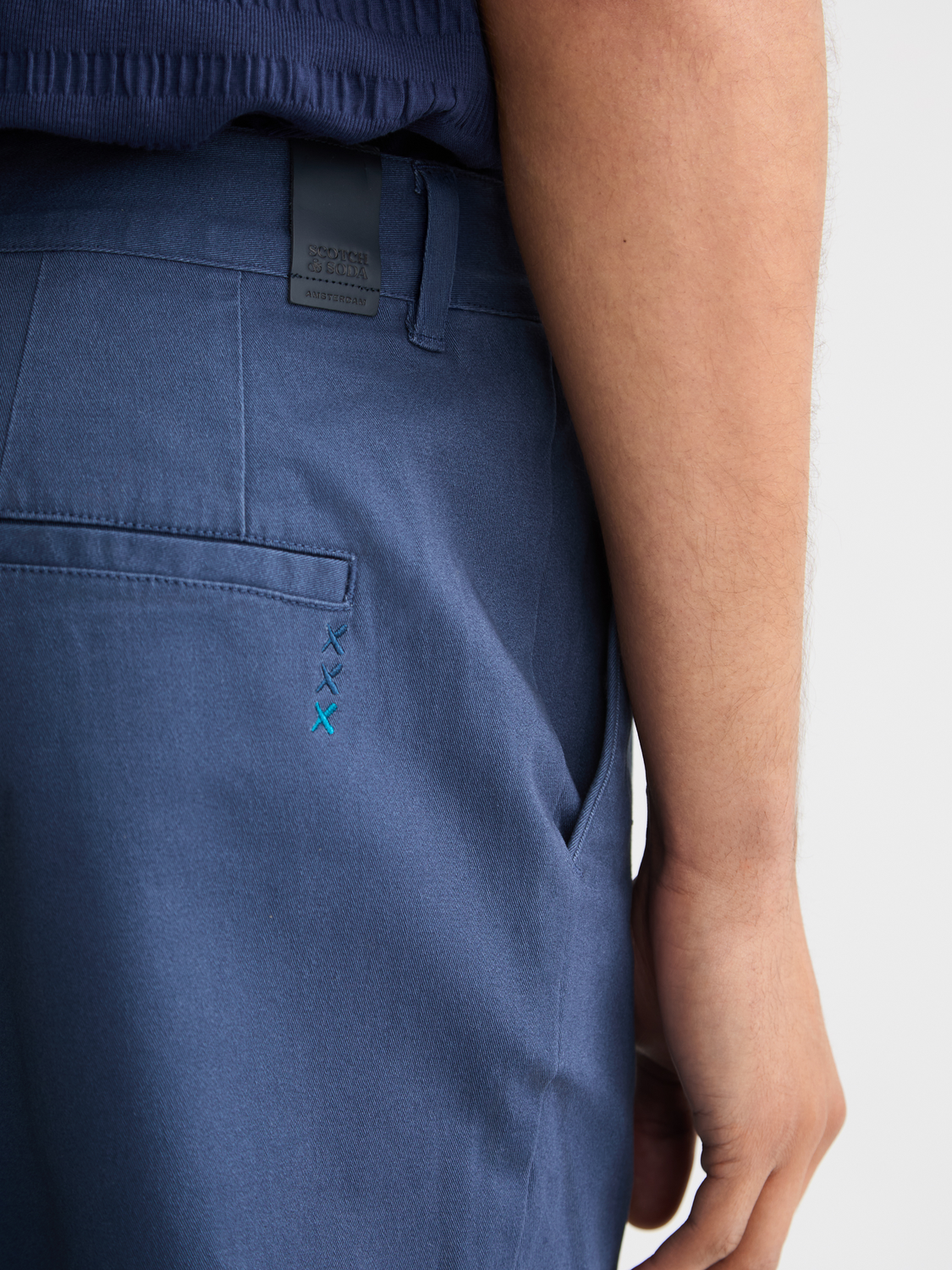 Drift tapered chinos by Scotch & Soda, stylish men's pants in a versatile tapered fit with a clean design and neutral color.