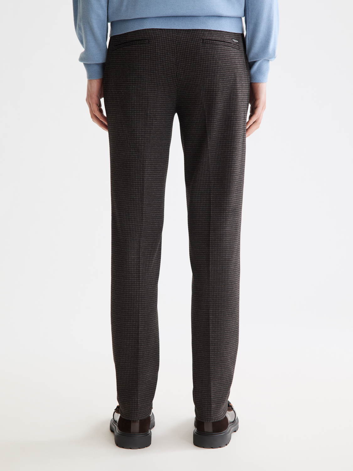 SCOTCH & SODA Mott super slim-fit chinos pants shown from the back, in a dark color with a tailored fit and belt loops.