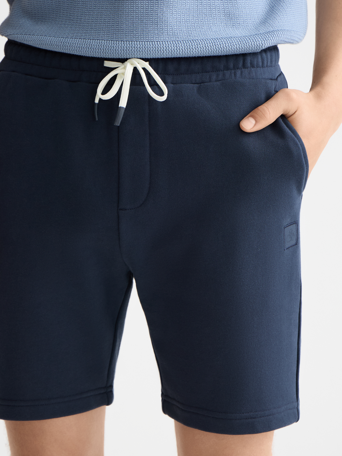 SCOTCH & SODA logo badge sweatshorts featuring a casual fit, soft fabric, and a branded logo badge on the leg.