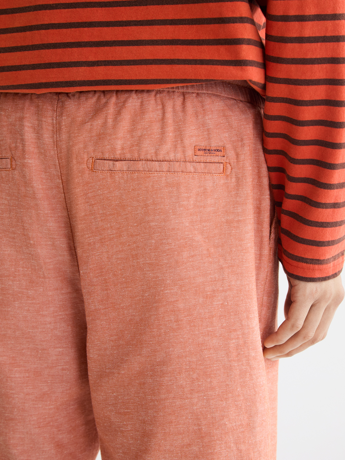 Light beige Fave cotton-linen shorts by SCOTCH & SODA featuring relaxed fit and casual style, shown on a model.