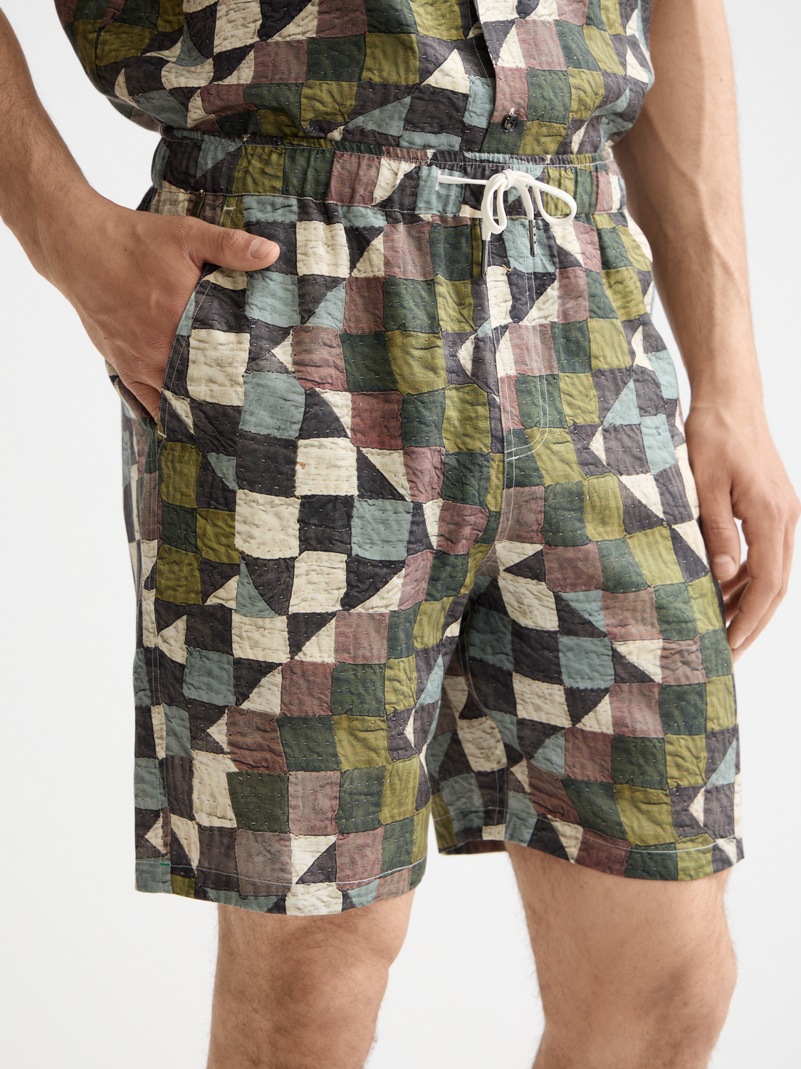 SCOTCH & SODA printed shorts with colorful floral pattern, casual summer style, front view showing vibrant design details.