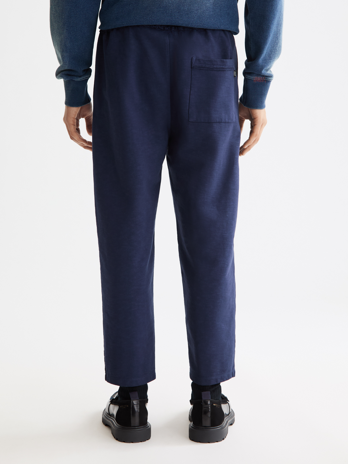 Scarlet garment-dyed sweatpants by Scotch & Soda, back view showcasing relaxed fit and soft fabric.
