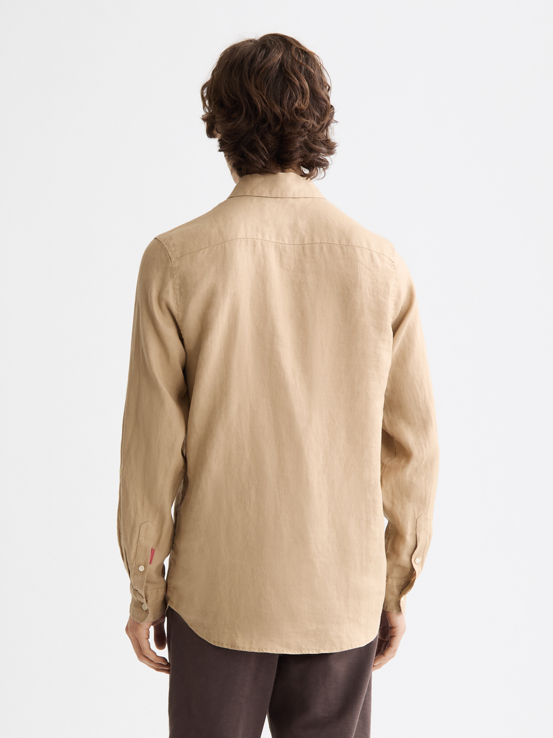Long-sleeve linen shirt by Scotch & Soda, shown from the back, with a relaxed fit and natural fabric texture.