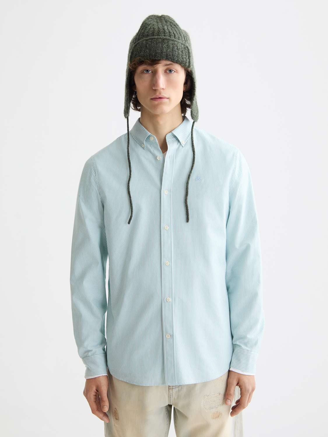 Long sleeve striped Oxford shirt by Scotch & Soda, featuring classic pattern and button-down collar, displayed on a hanger.