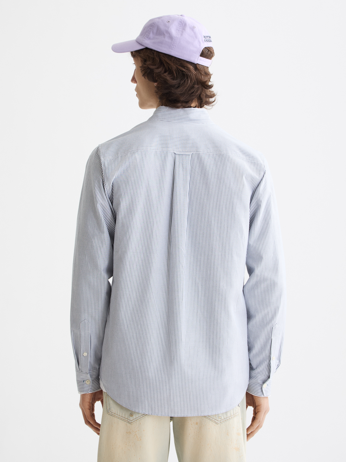 Long sleeve striped Oxford shirt by Scotch & Soda, shown from the back with classic blue and white vertical stripes.