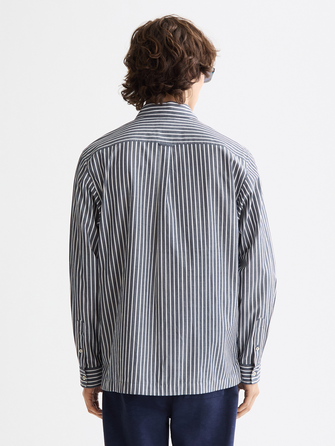 Long sleeve striped poplin shirt by Scotch & Soda, shown from the back with a classic collar and multicolor horizontal stripes.