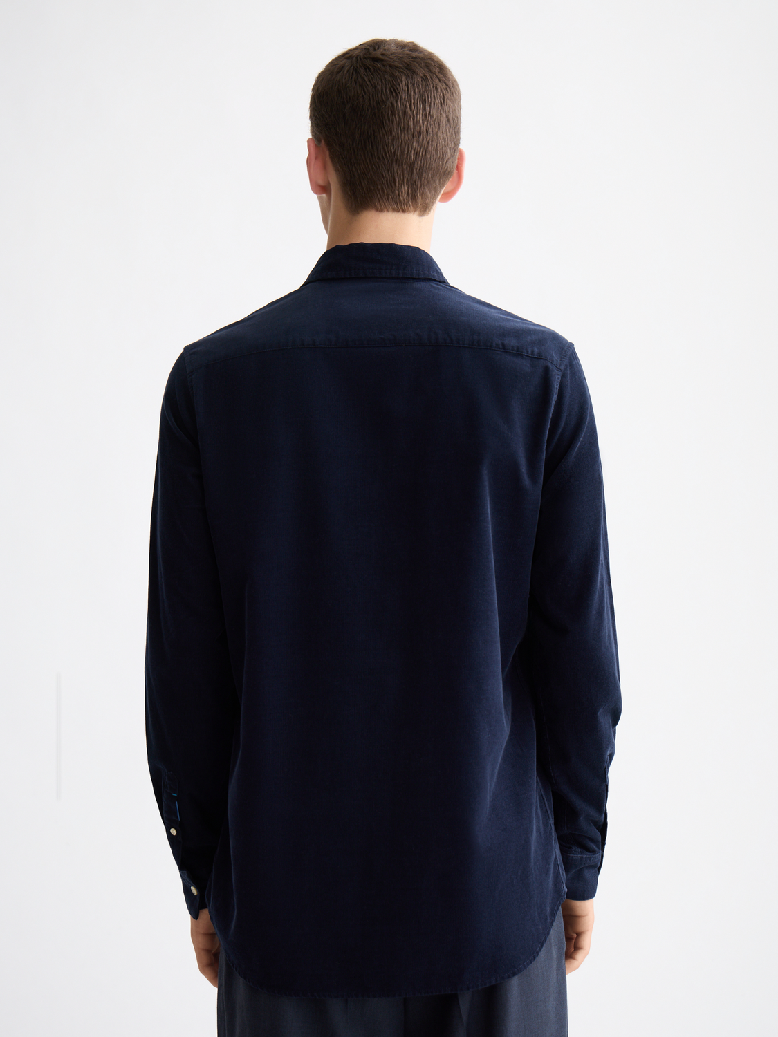 Long-sleeve Scotch & Soda corduroy shirt with a back view, featuring a classic collar and textured fabric in earthy tones.