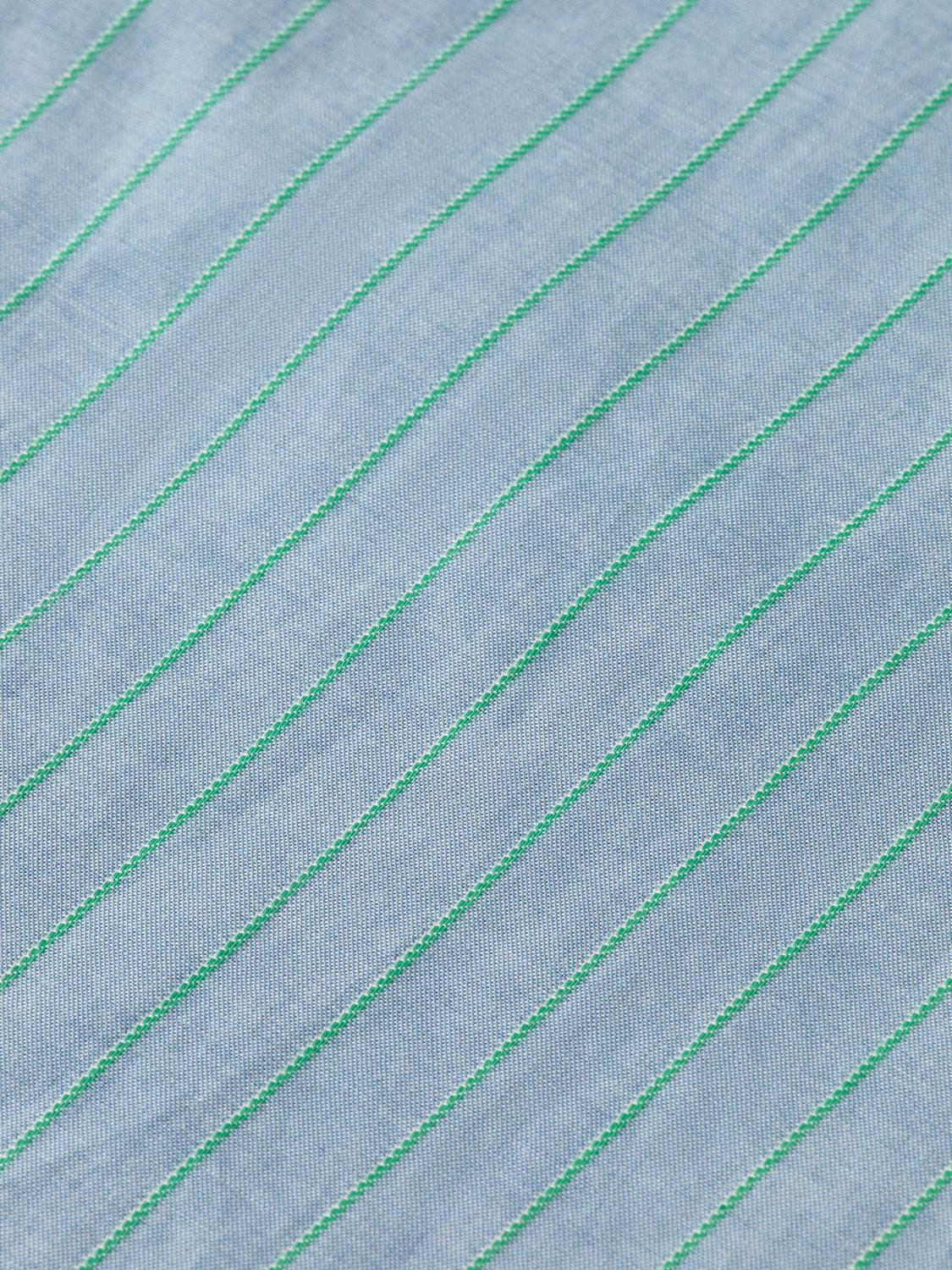 Long sleeve striped shirt by Scotch & Soda, yarn-dyed fabric with blue and white horizontal stripes, displayed on a hanger.